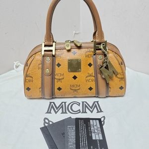 Authentic mcm congnac small Boston bag with charm